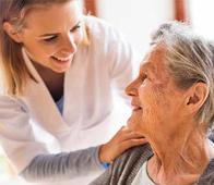 nurse and patient in a long term care facility